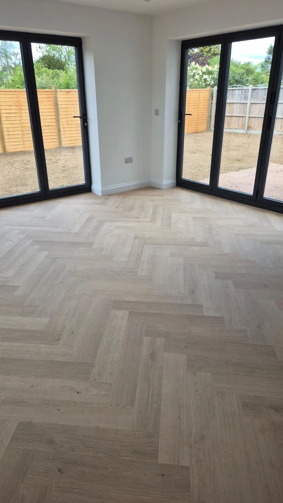 Pale herringbone beside garden doors
