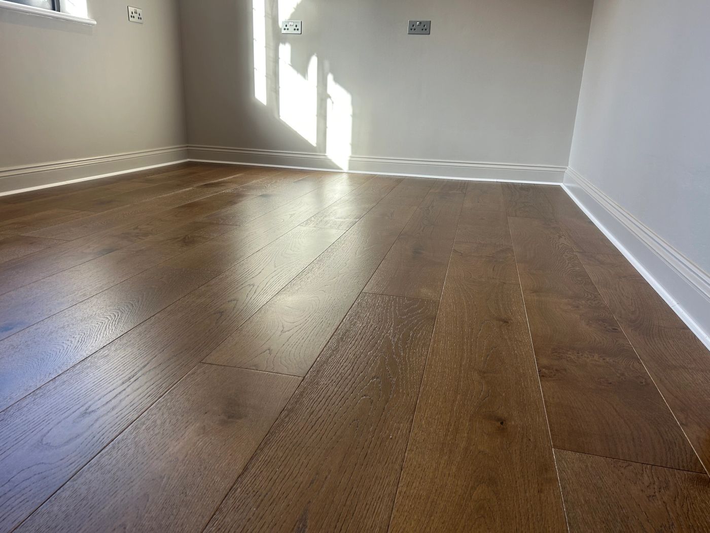 Wide wood planks in a bright room