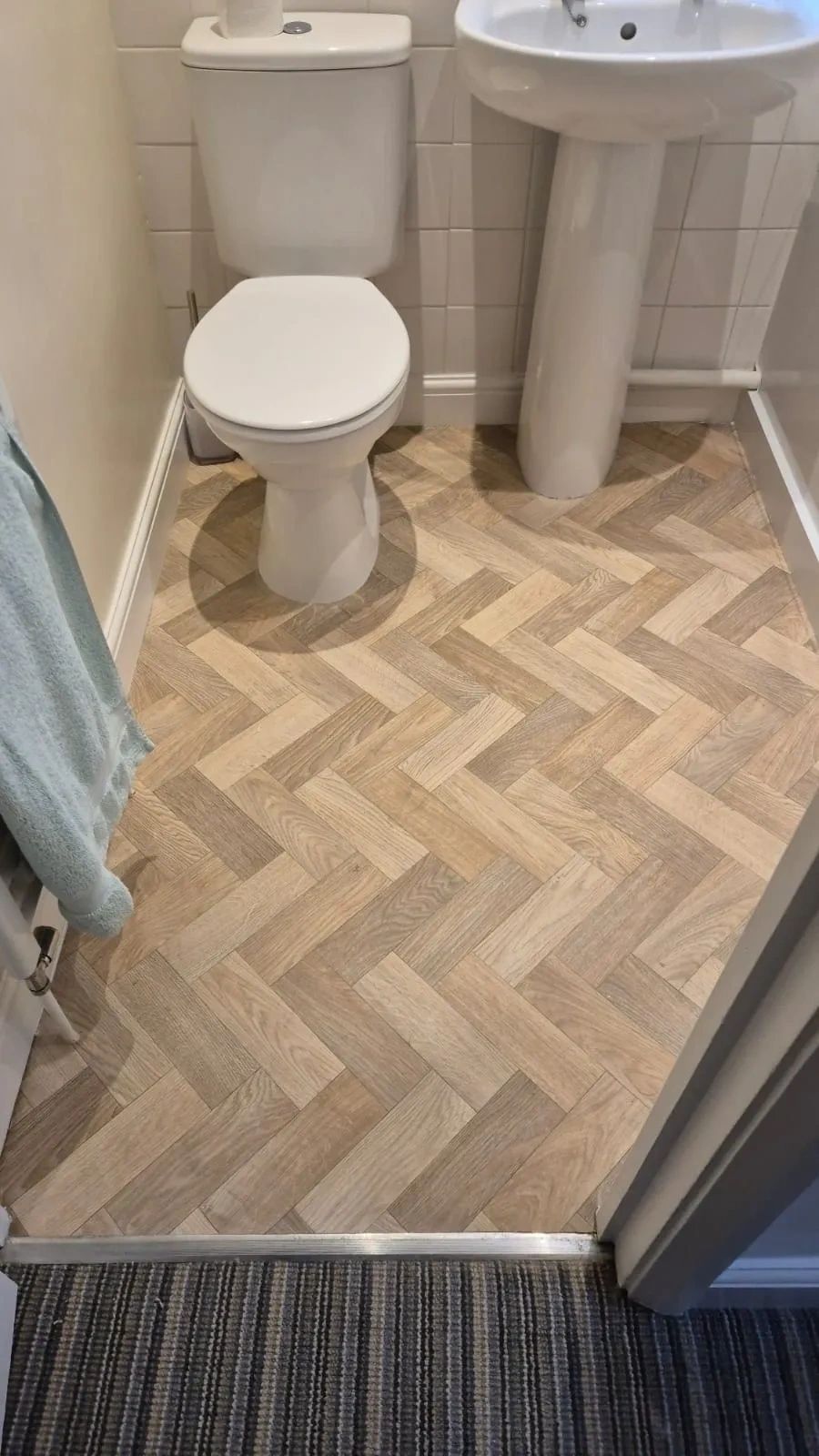 Herringbone flooring in a bathroom